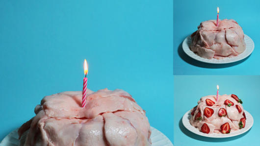 A set of three pictures with a birthday cake made from meat, put on a plate and a candle lite on it. One of the variants has strawberries all over the cake.