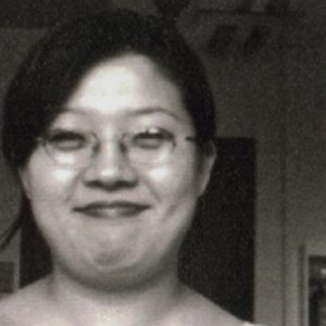 A photo of a smiling woman.