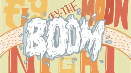 An orange and yellow banner with the word Boom made from white paint splashes.