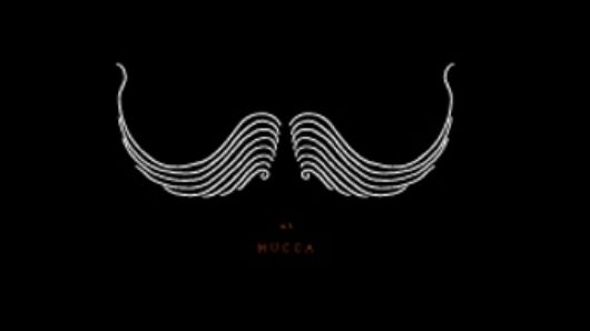 A poster of a white moustache like design on a black background.