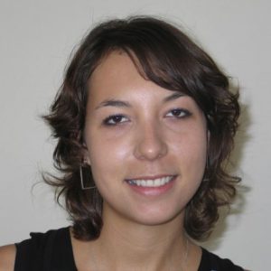 A photo of a woman wearing a black undershirt.