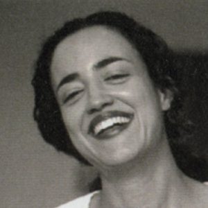 A photo of a woman smiling.