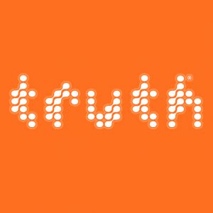 An orange poster that has letters made from connected white dots.