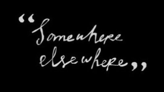 A black background with some white text that says: Somewhere elsewhere.