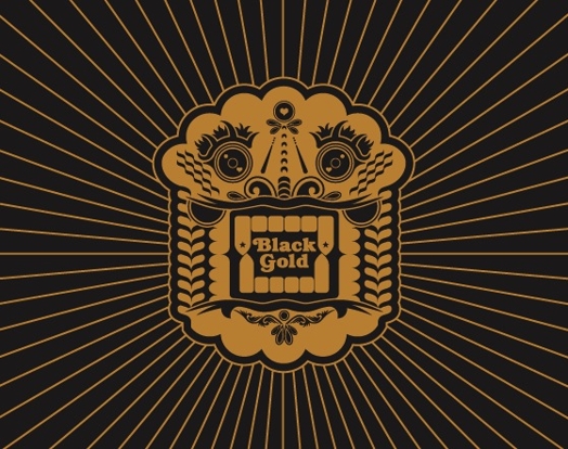 A black and gold colored drawing of a shape from Latin American culture with the text: Black Gold.