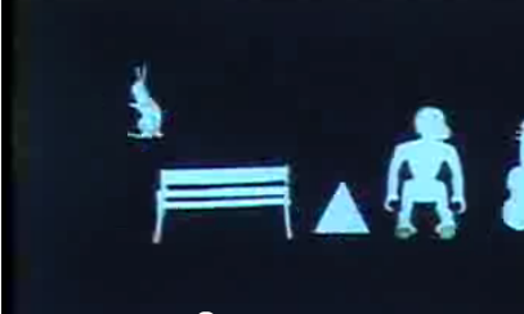 A computer generated image showing a blue bunny, a bench, a triangle and a human figure.