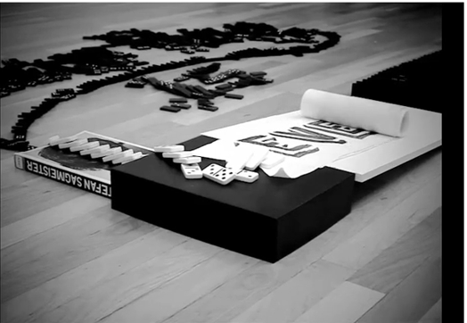 A black and white photo of a domino game.
