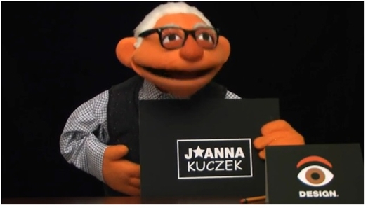 A photo of a poppet portraying an old man with a card that says J Star Anna Kuczek.