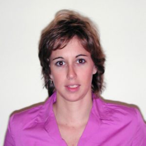 A photo of a woman wearing a purple shirt.