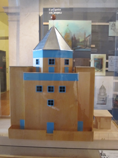 A 3d model of a building made from cardboard.