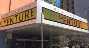 The SVA Theatre entrance with the word VENTURE written on the changing advertisement section.