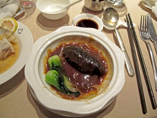 A photo of a dish with some exotic jelly looking food.