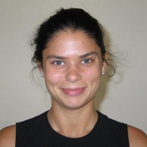A photo of a smiling woman wearing a black shirt.