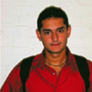 A photo of a man wearing a red shirt.