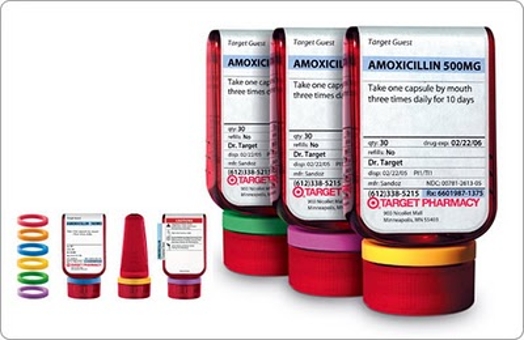 An image of some rainbow colored rings used on some red pharmaceutical plastic bottles to better distinguish the pills inside.