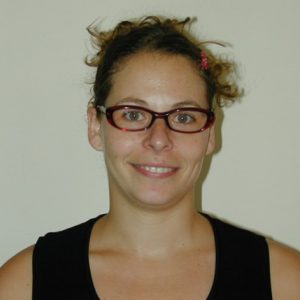 A photo of a woman smiling.