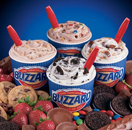 A photo of some oreo, cookie, cherry and m&m's flavored ice creams from Blizzard. company