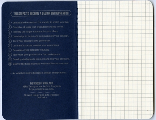 A blue notebook with text on a side and squares on the other.