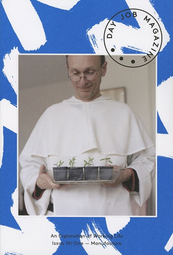 A photo of a man dressed in white and holding a tray of flowers. The photo is stitched on a blue paper with white painted lines and over them is a stamp.