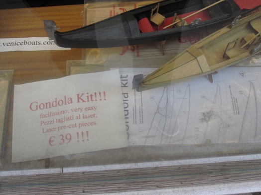 A photo of a miniature wood gondola kit along with assembly instructions.