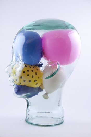 A human head made from glass filled with inflated balloons.