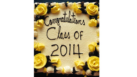 A photo of a cake with yellow roses on it and the text written in chocolate that says: Congratulations Class of 2014.