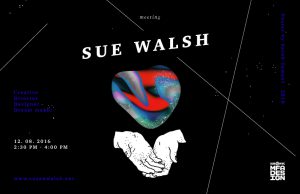 A black poster with a heart shaped multicolored figurine and some white drawn hands put together. The heart shape has the texture of galaxies seen at night. The title of the poster says: Sue Walsh.