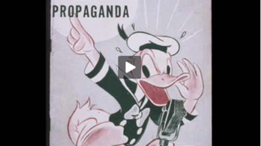 An old cartoon of Donald Duck shouting at a microphone: What is propaganda.