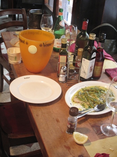 A photo of a table with food and beverages on it.