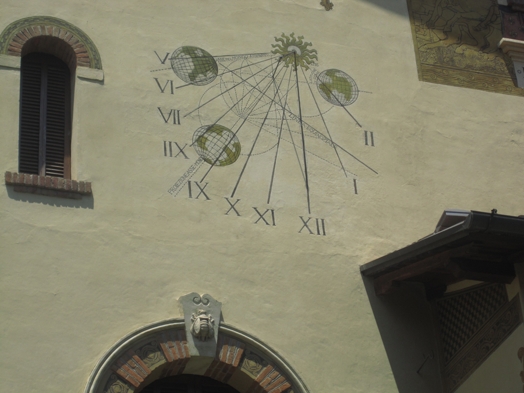 A photo of a stone fresco showing lines, planet alignment, and Roman numerals that form what seems like a static monthly calendar.