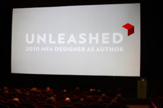 A photo of a projection screen showing a red cube and the title: Unleashed 2010 MFA DESIGNER AS AUTHOR