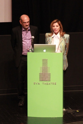 A photo of two people giving a lecture at a green stand that has the text SVA Theatre on it.