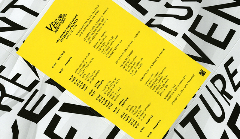 A yellow poster, placed on some black and white papers which has the entire Venture Design Entrepreneur schedule on it.