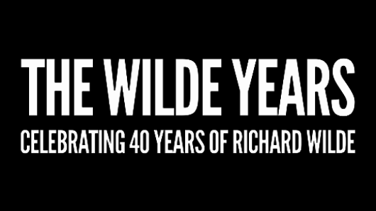 A black banner with a white text that says: The Wilde Years CCelebrating 40 Years Of Richard Wild