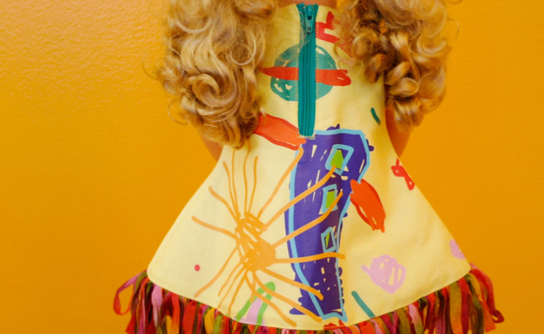 A photo of a dolls colorful dress.