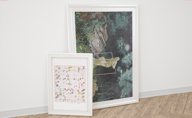 abstract illustrations in a white wooden frame is placed on the floor near a wall