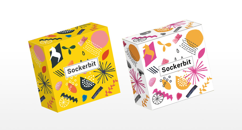 A set of two boxes, one yellow and one white, with pictograms on them like animals or plants. On each box there is a label with text: Sockerbit.