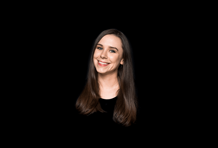 A photo of a woman wearing a black blouse.