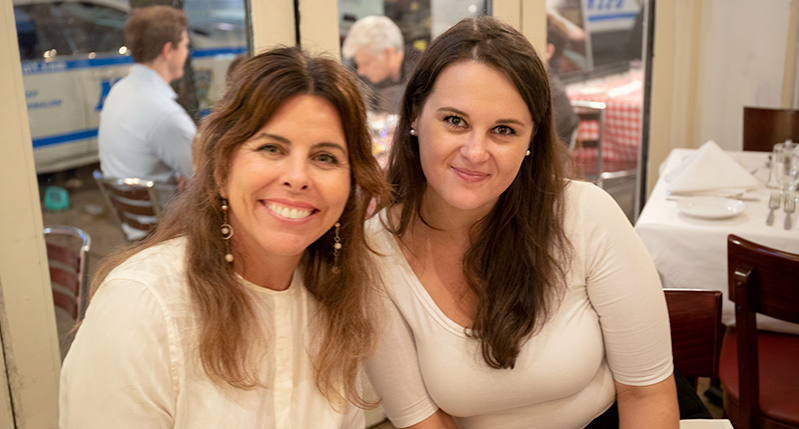 portrait of two women in a restaurant