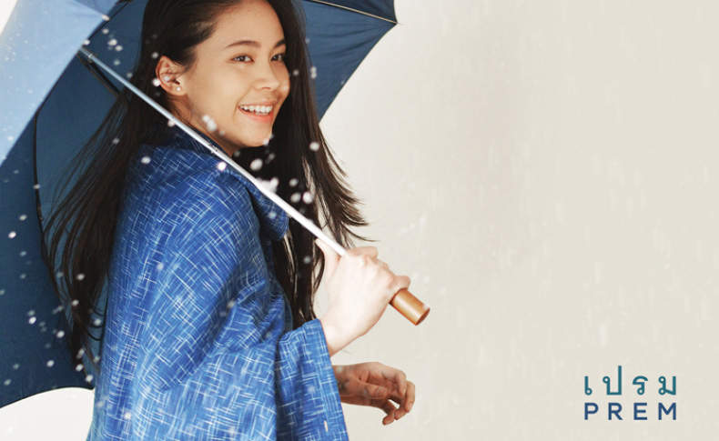 a woman with a dark blue umbrella