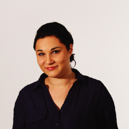 A photo of a woman wearing a black blouse.