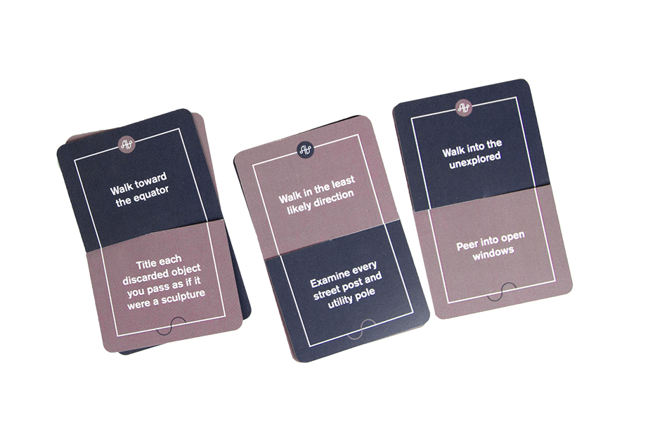 A set of cards, each split into a black and gray color with some white text on them.