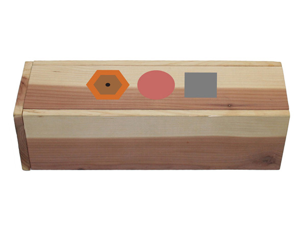 a wooden box with a hexagonal pencil shape, a red rubber shape, and a grey square shape