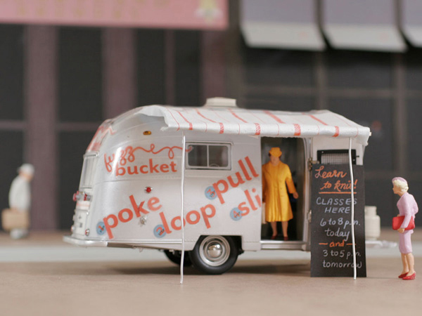 model of a fuzz bucket food truck opened with people buying food
