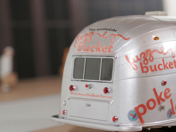 close-up of a food van with fuzz bucket logo on it