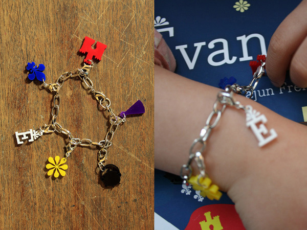 a kids bracelets with flowers and letters