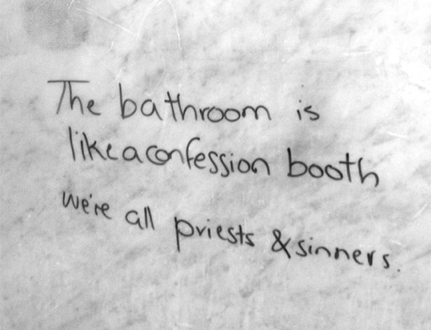 A surface with a text written on it: the bathroom is like a confession booth we're all priests & sinners.