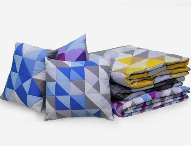 bed sheets and pillows with triangular shapes pattern