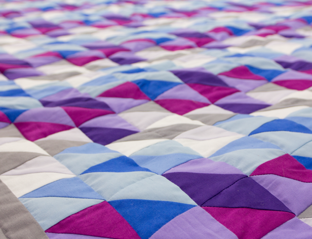 a fabric with triangular pattern in blue and purple