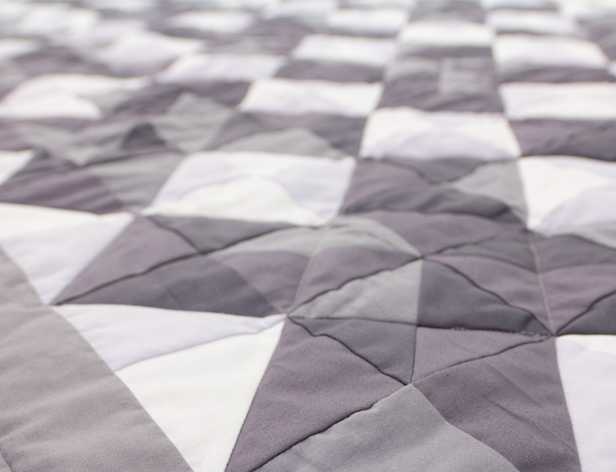 a fabric with triangular pattern in grey